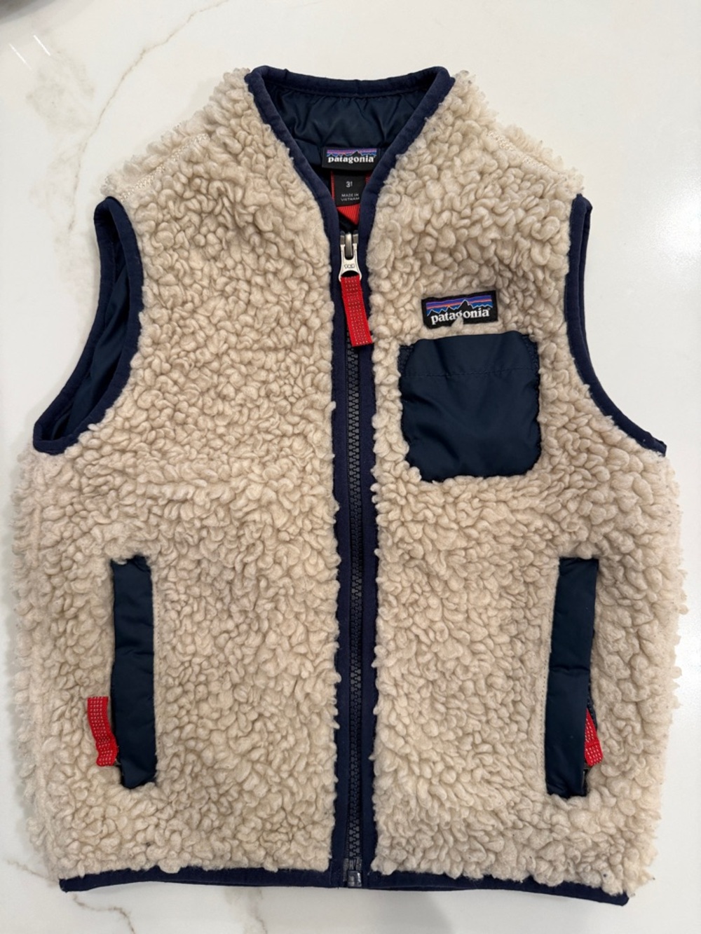 Patagonia Cream Sherpa Vest with Navy Trim and Red Accents